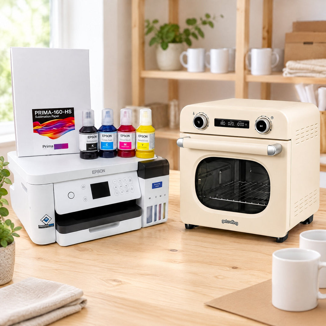 Sublimation oven starter kits: a cream sublimation oven, an Epson printer with ink bottles, a pack of Prima 160 HS sublimation paper and white mugs on a desk