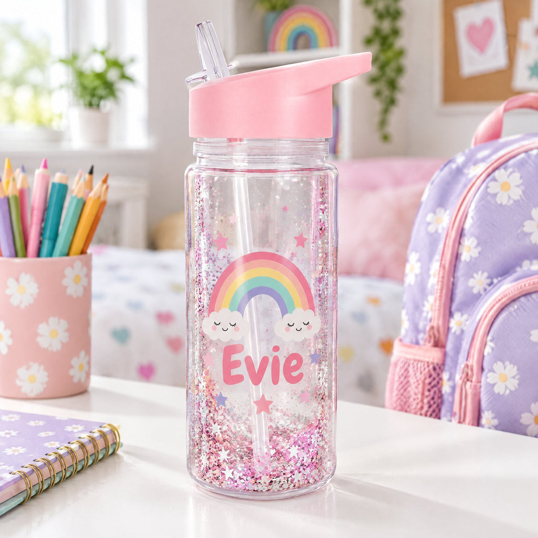 10oz snowglobe bottle printed with a pastel rainbow, stars and the name Evie, on a child&