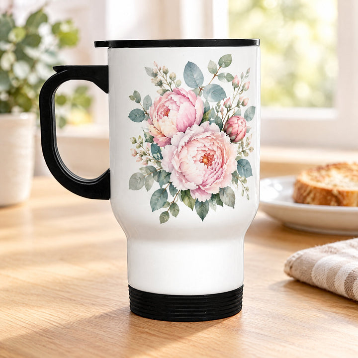 14oz stainless steel travel mug, white, printed with peonies and soft eucalyptus, on a wooden kitchen table