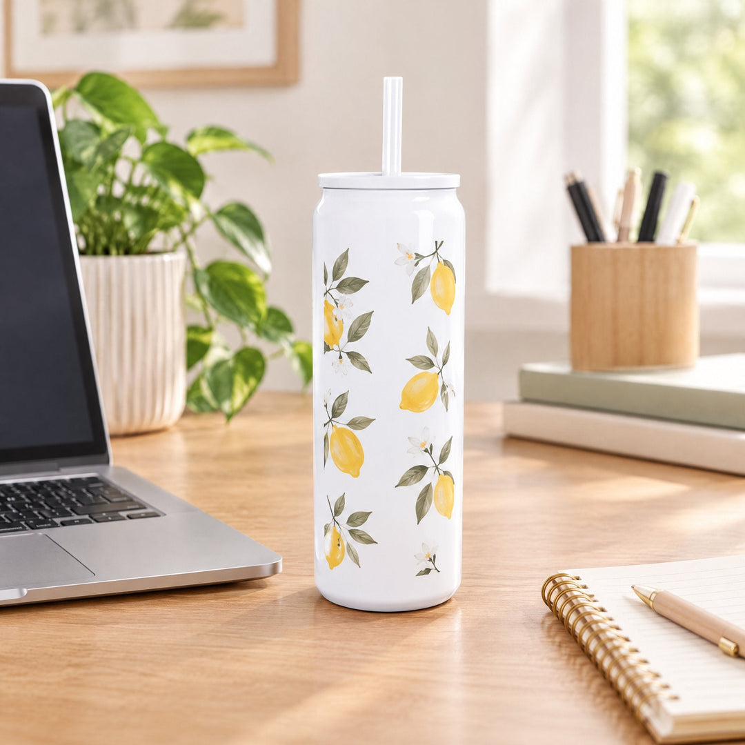 16oz sublimation tumbler printed with lemons and leaves, on a wooden desk