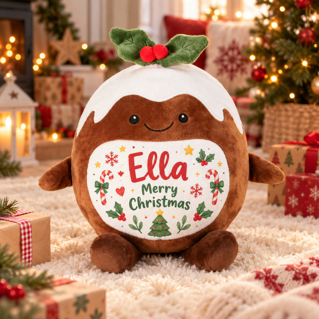Personalised Christmas Pudding plush toy with "Ella Merry Christmas" design in a festive room
