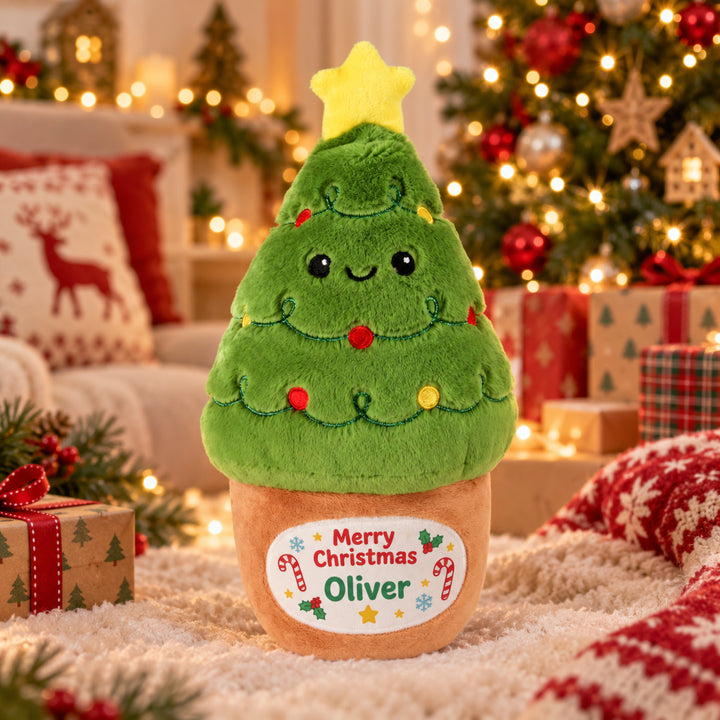 Personalised Christmas Tree plush toy with "Merry Christmas Oliver" on the pot, in a festive room 