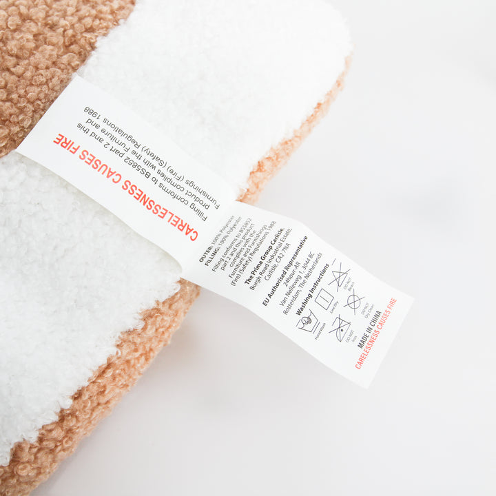 Gingerbread House cushion care label with fire safety warning and washing instructions 