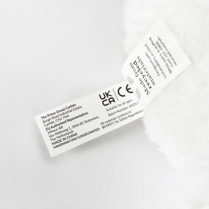 Snowman plush toy safety label showing UKCA and CE marks and BS EN71 compliance
