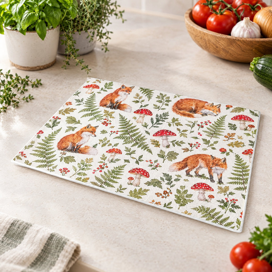 A3 sublimation chopping boards printed with foxes, ferns and toadstools, on a kitchen worktop