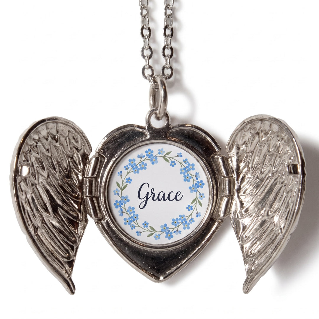 Angel wings locket printed with blue forget-me-not flowers and the name Grace