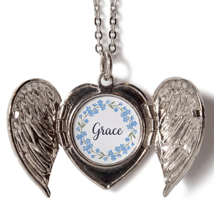 Angel wings locket printed with blue forget-me-not flowers and the name Grace