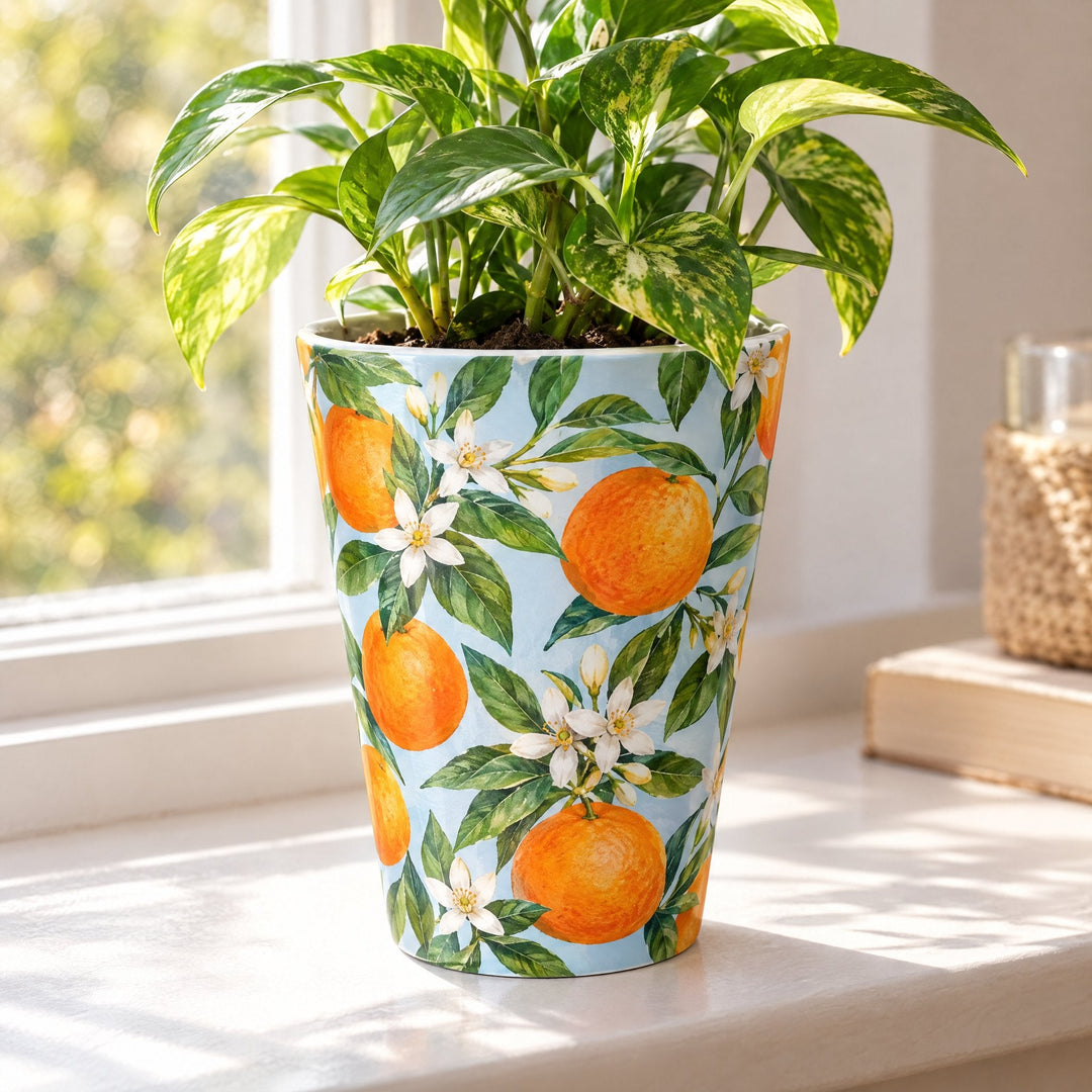 Blank sublimation ceramic plant pot printed with oranges, on a windowsill