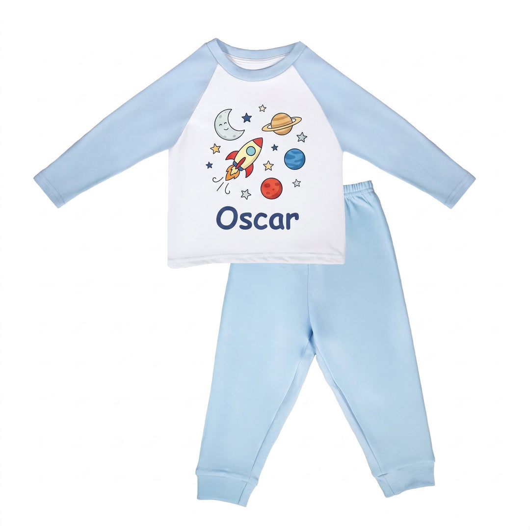 Sublimation pyjamas, blue, printed with a rocket, moon, planets and stars and the name Oscar