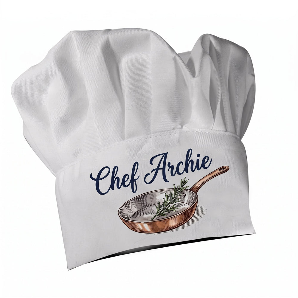 Child's chef hat printed with an engraved-style copper pan and a sprig of rosemary and the words 'Chef Archie'