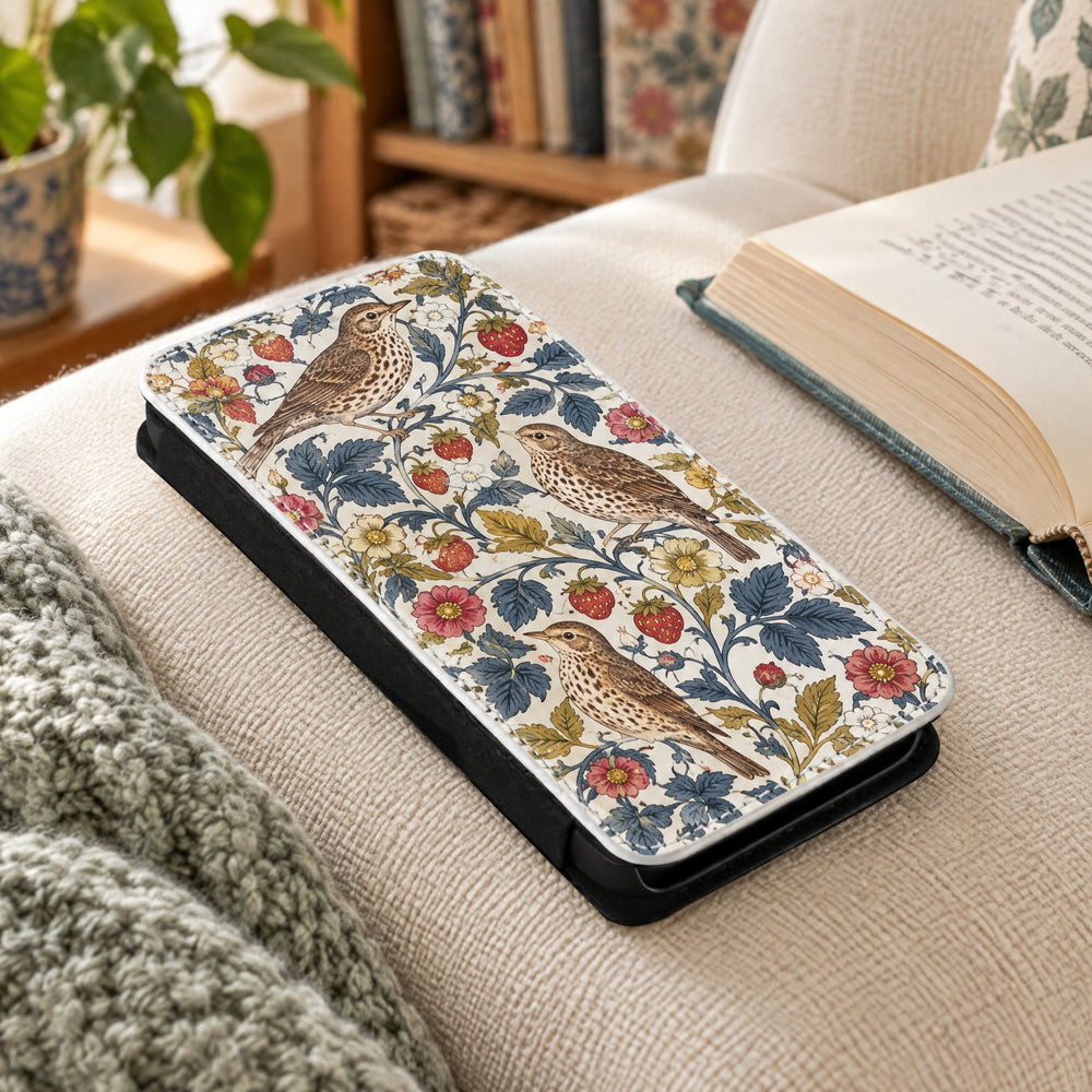 iPhone 13 Pro Max phone cover printed with song thrushes, on an armchair