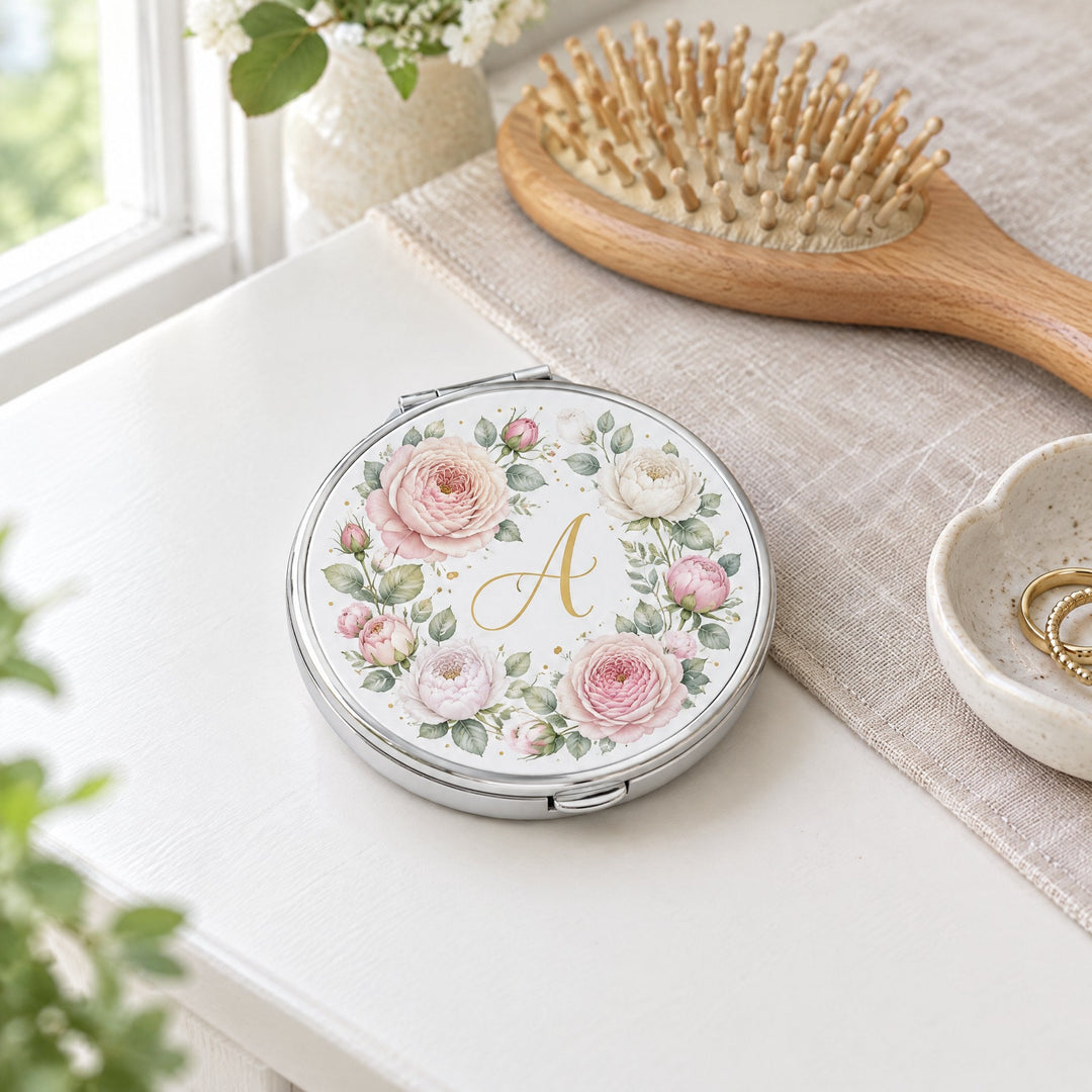 Spare insert for round sublimation compact mirror printed with blush garden roses, lying on a dressing table